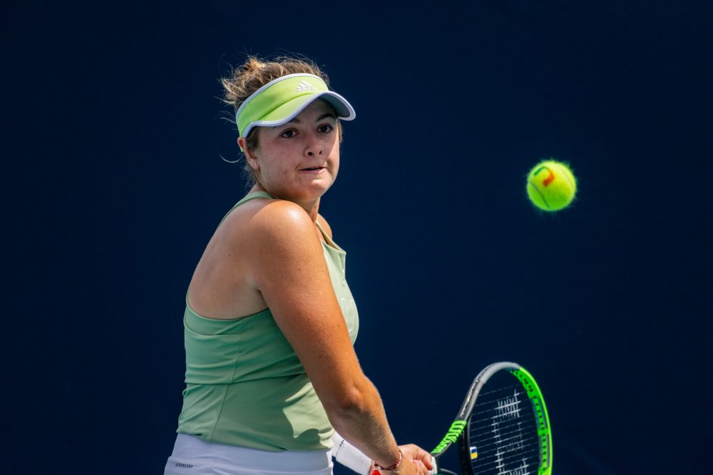 Third-year sophomore Diana Khodan returns the ball during her singles match against Columbia junior Michelle Xu at the Miami Open on Friday, April 1, 2022.