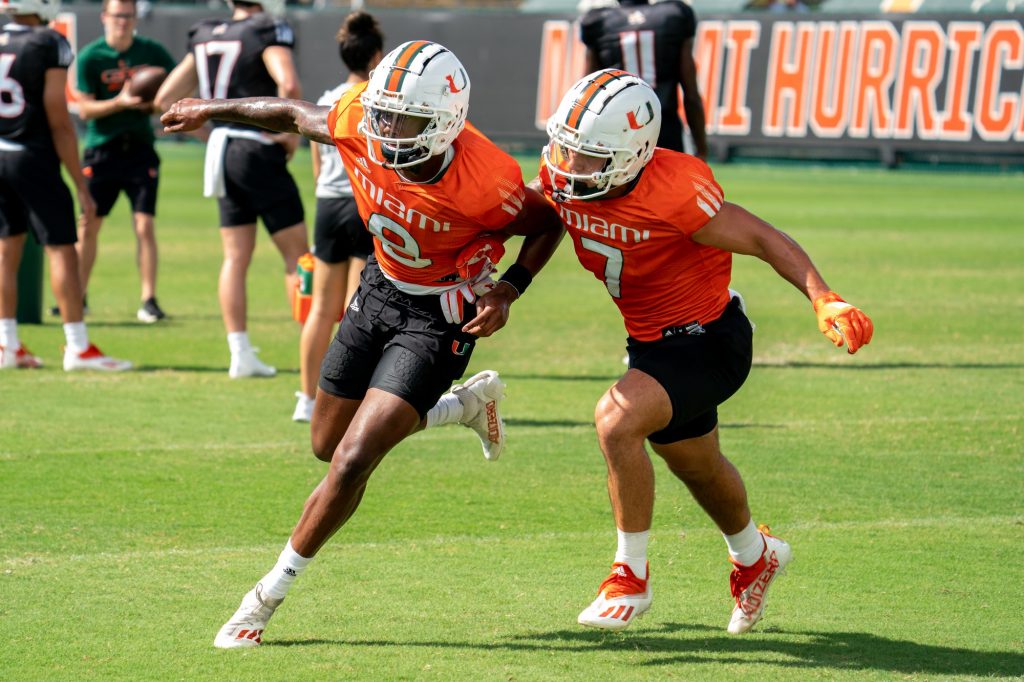 Fourth-year junior wide receiver Frank Ladson, Jr. sheds defending third-year sophomore wide receiver Xavier Restrepo during drills at the Greentree Practice Fields on March 11, 2022.