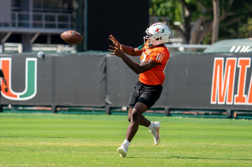Sophomore wide receiver Brashard Smith catches a ball during drills at the Greentree Practice Fields on March 11, 2022.