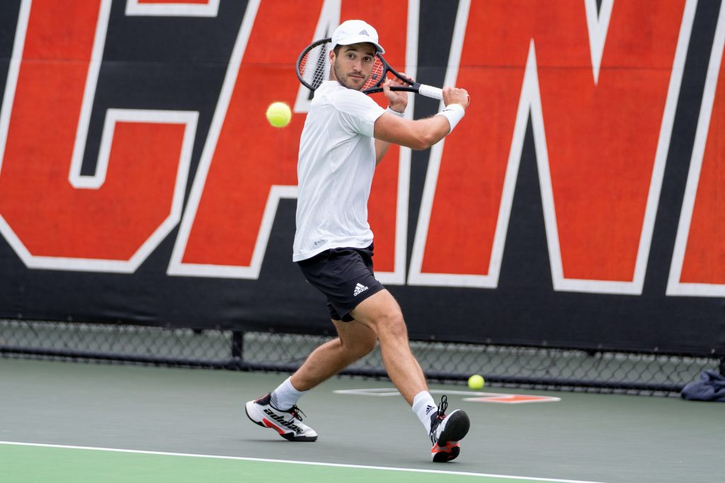 Graduate student Dan Martin returns the ball during his singles match versus sophomore Ryan Fishback at the Neil Schiff Tennis Center on April 8, 2022.