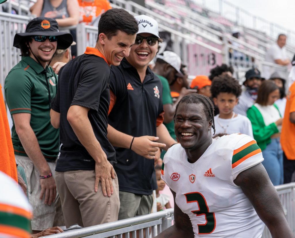 Fifth-year redshirt junior linebacker Gilbert Frierson laughs with fans at the conclusion of Miami's Spring Game at DRV PNK Stadium on April 16, 2022.
