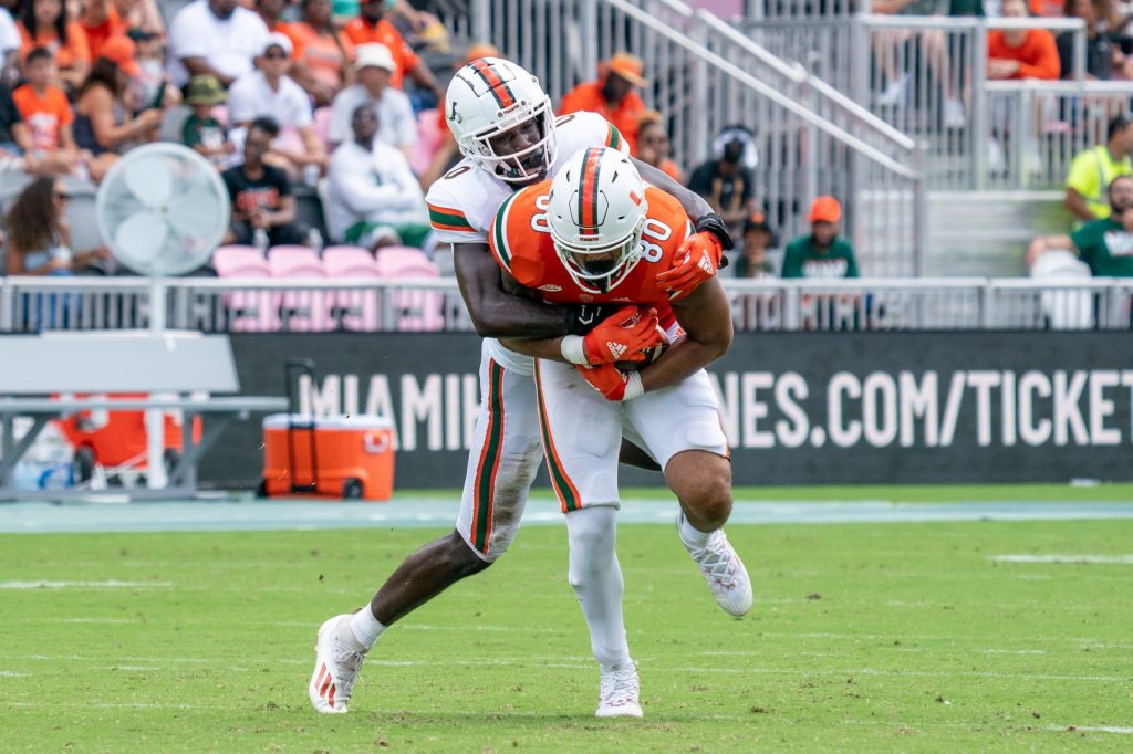 Sophomore safety James Williams tackles sophomore tight end Elijah Arroyo during Miami's Spring Game at DRV PNK Stadium on April 16, 2022.