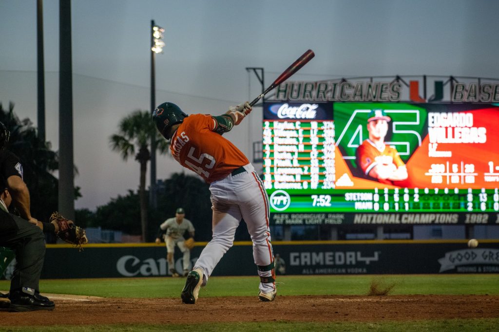 Freshman outfielder Edgardo Villegas hits the ball in the bottom of the fifth inning during No. 3 Miami's game against Stetson University on April 26, 2022 at Mark Light Field.
