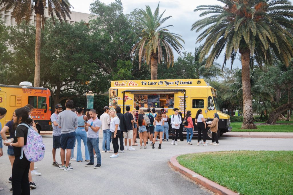 Students wait in line to eat at the Mediterranean food truck.