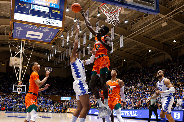 DURHAM, NC - JANUARY 08: Deng Gak #22 of the Miami Hurricanes blocks a shot by Paolo Banchero #5 of the Duke Blue Devils in the first half at Cameron Indoor Stadium on January 8, 2022 in Durham, North Carolina. (Photo by Lance King/Getty Images)