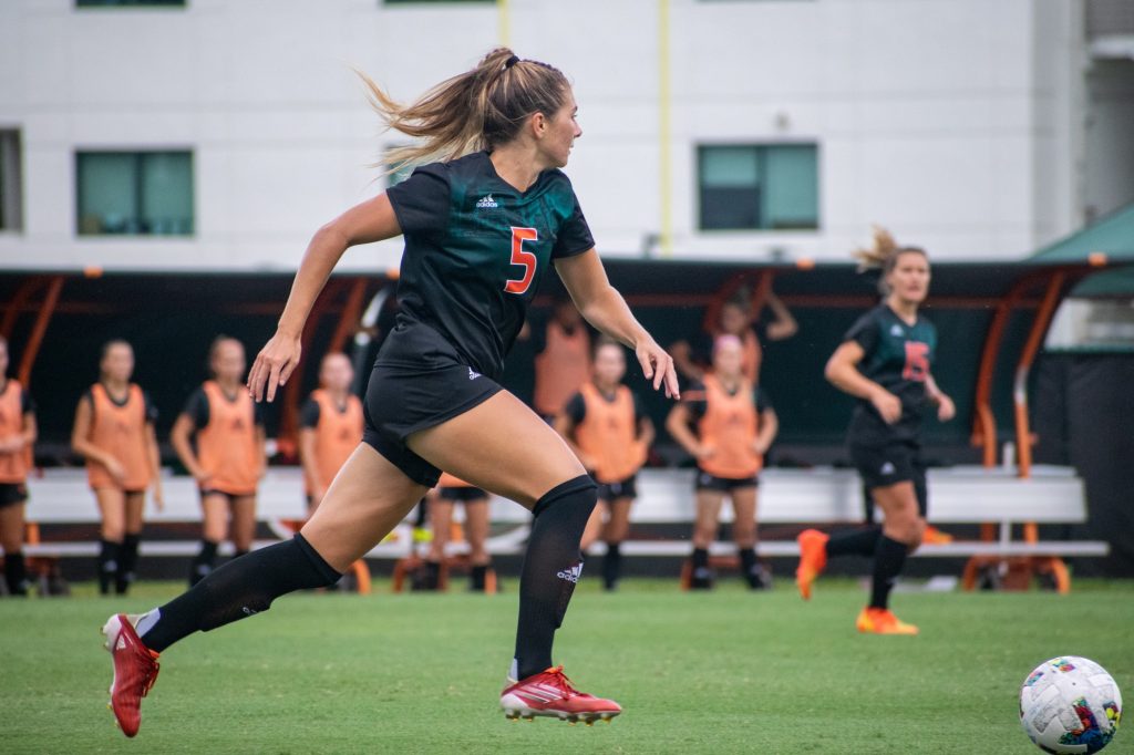 Sophomore Defender Claire Llewellyn runs the ball down the field during Miami's win against North Florida on Aug 28 at Cobb Stadium.