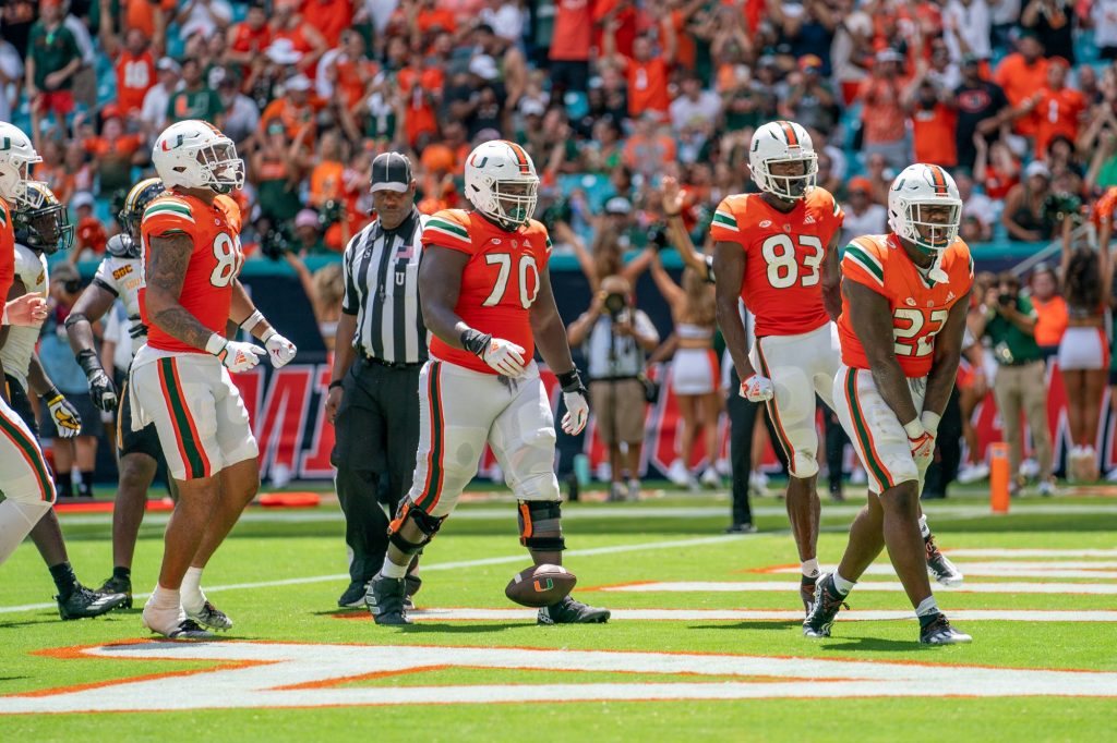 Sophomore running back Thaddius Franklin, Jr. celebrates after diving into the end zone for a touchdown during the third quarter of Miami’s game versus the University of Southern Mississippi at Hard Rock Stadium on Sept. 10, 2022.