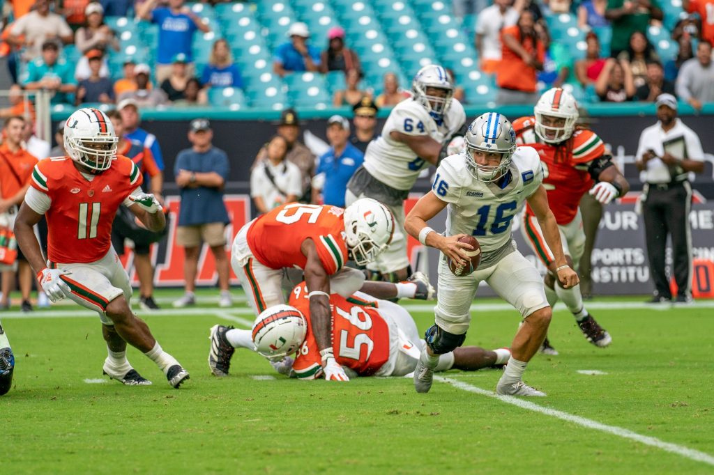 Blue Raiders redshirt senior quarterback Chase Cunningham evades a sack during the third quarter of Miami’s game versus Middle Tennessee State at Hard Rock Stadium on Sept. 24, 2022.