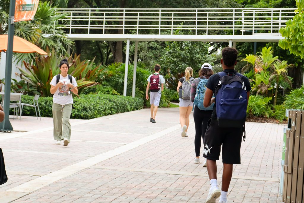 University of Miami students walk between class along the path to their afternoon classes on Sept. 16.