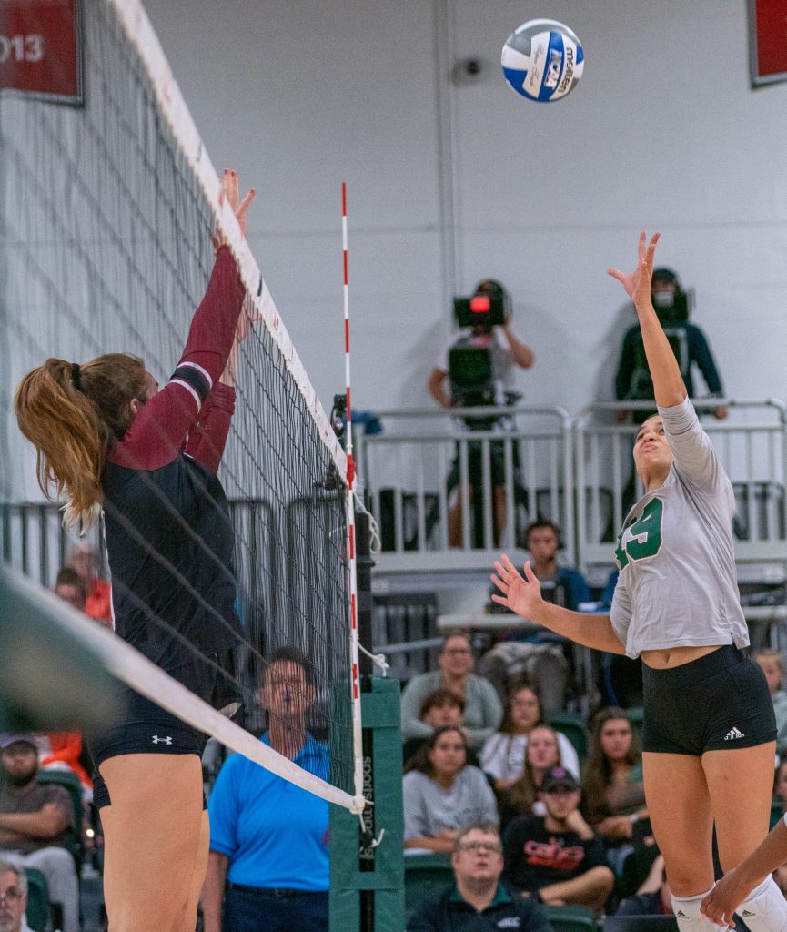 Sophomore outside hitter Peyman Yardimci tips the ball during the first set of Miami’s match versus the University of South Carolina in the Knight Sports Complex on Sept. 16, 2022.