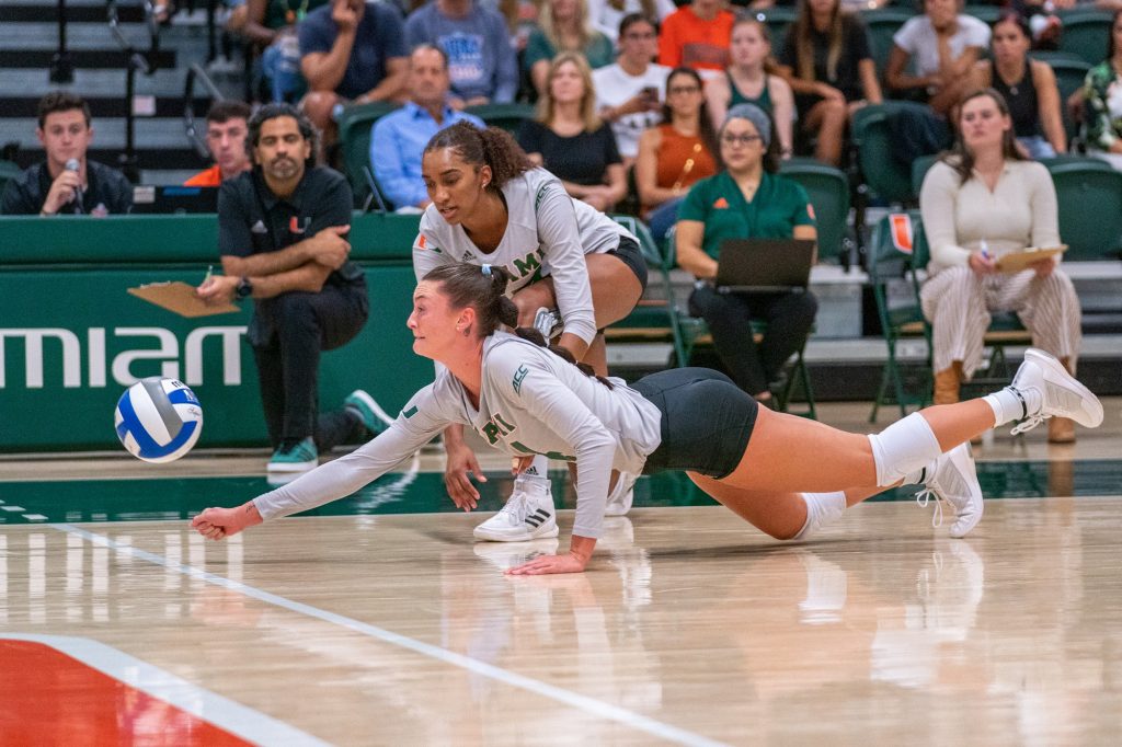 Redshirt junior outside hitter Angela Grieve dives for the ball during the first set of Miami’s match versus the University of South Carolina in the Knight Sports Complex on Sept. 16, 2022.