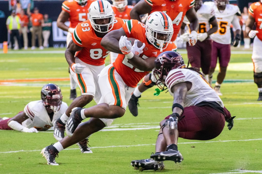 Sophomore running back Thaddius Franklin, Jr. takes down members of Bethune-Cookman's defense during Miami's victory on Sept. 3 at Hard Rock Stadium.