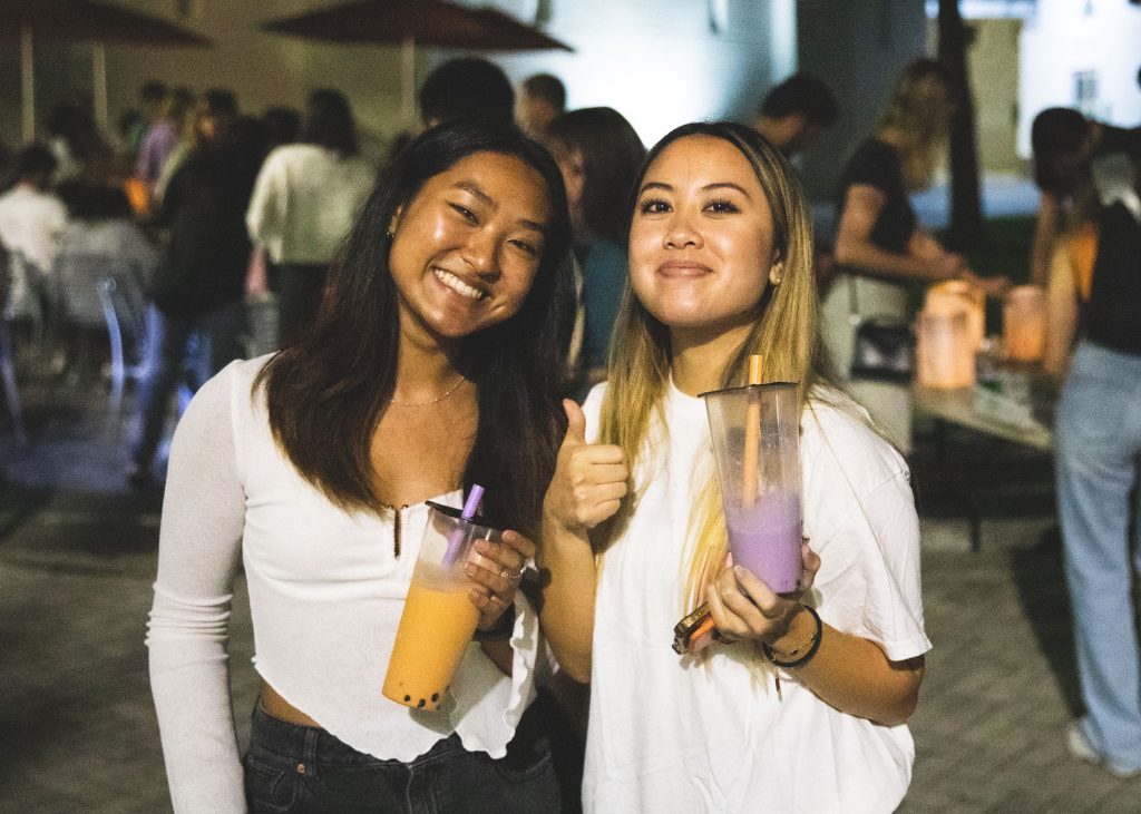 Ann Sia and Lauri Vuong enjoy complimentary boba at the Lantern Festival on Oct. 22 in the architecture courtyard.