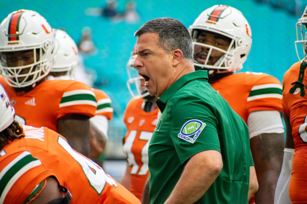 Head coach Mario Cristobal yells at players during Miami's warm up on Sept. 24, 2022 at Hard Rock Stadium.