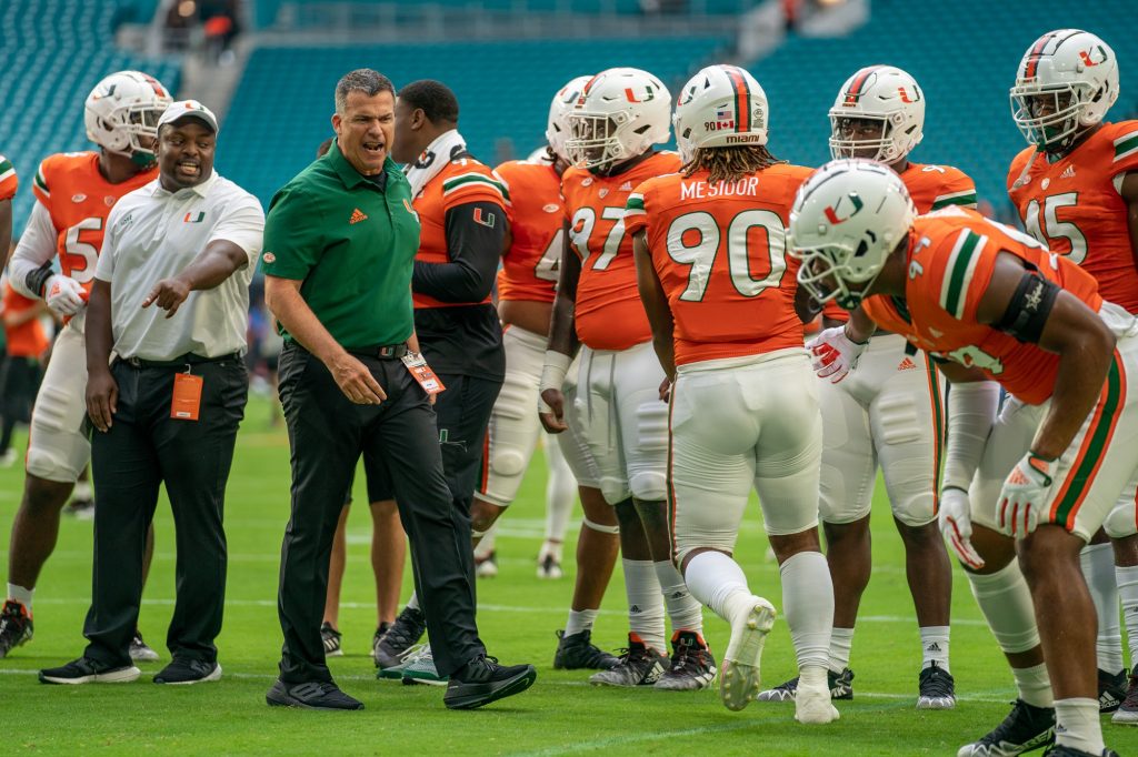 Head coach Mario Cristobal coaches players in warmups before Miami’s game versus Middle Tennessee State at Hard Rock Stadium on Sept. 24, 2022.