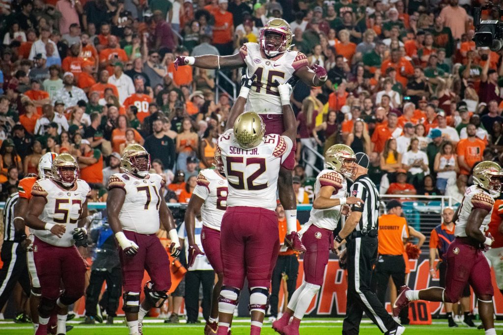 Two Flordia State Univeristy players celebrate a touchdown during Miami's 45-3 loss on Saturday, Nov. 5 at Hard Rock Stadium.