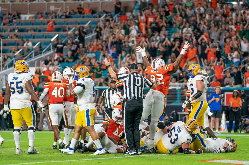 The Canes defense celebrates after getting a stop on fourth down short of the goal line during the first quarter of Miami’s game versus the University of Pittsburgh at Hard Rock Stadium on Nov. 26, 2022.