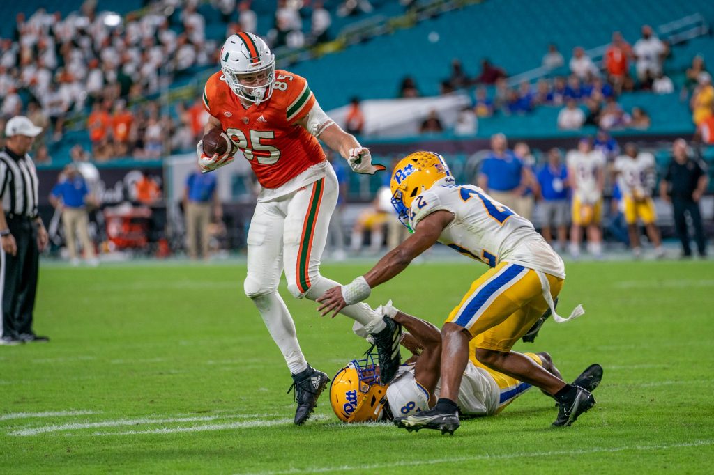 Fifth-year senior tight end Will Mallory attempts to lose a defender after catching a pass during the fourth quarter of Miami's game versus Pittsburgh at Hard Rock Stadium on Nov. 26, 2022.