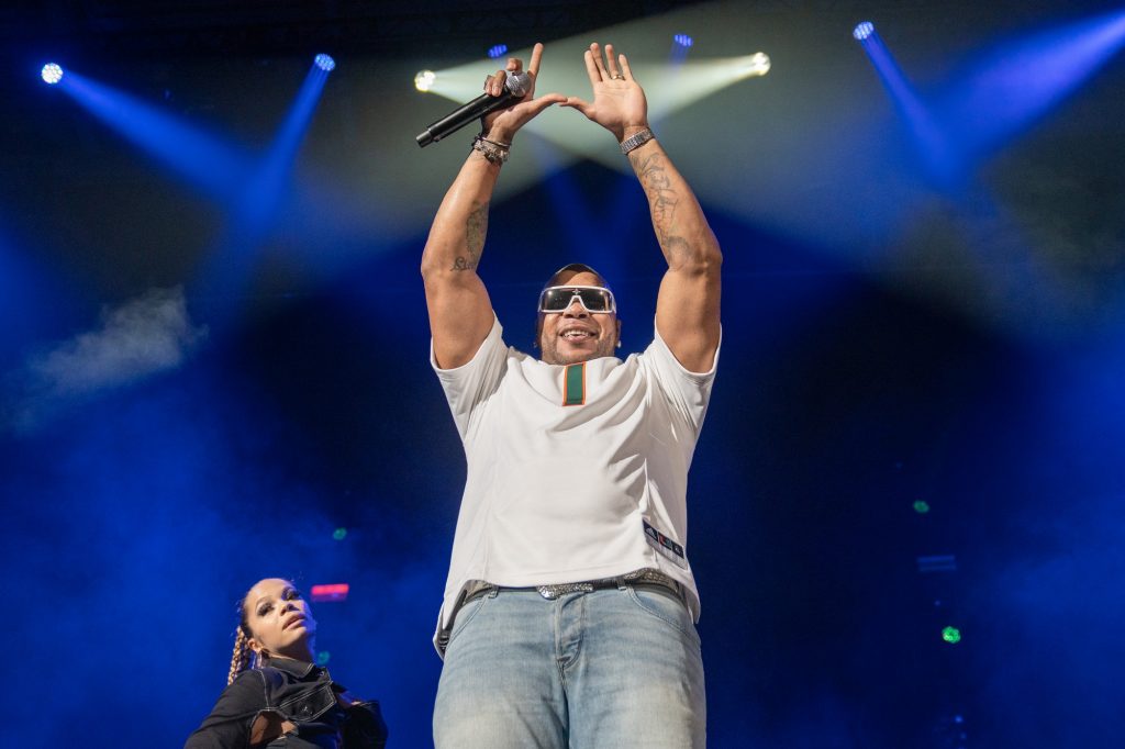 Rapper Flo Rida throws up the U at the Hurricane Productions Homecoming Concert in the Watsco Center on Nov. 3, 2022.