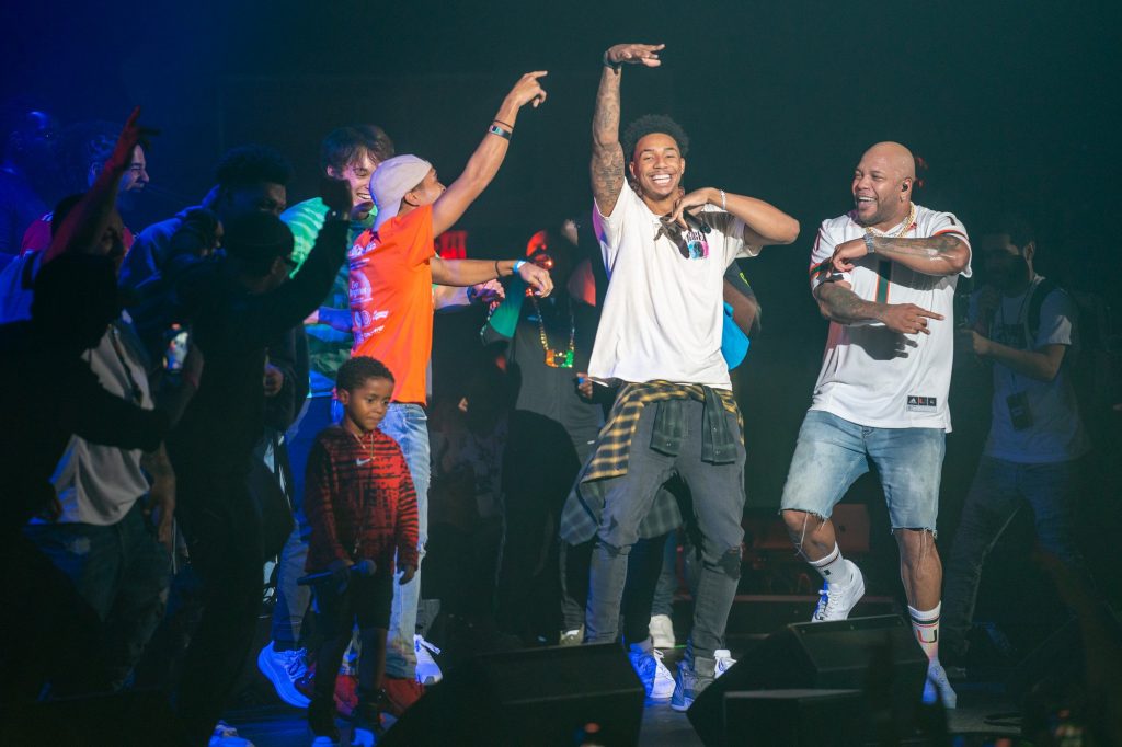 Canes basketball player Jordan Miller raps on stage with Flo Rida at the Hurricane Productions Homecoming Concert in the Watsco Center on Nov. 3, 2022.