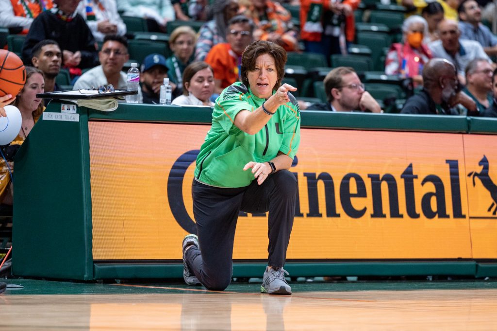 Head coach Katie Meier points out a spot of a foul to a referee during Miami's Big10 matchup against the University of Michigan on Thursday, Dec. 1 at the Watsco Center.