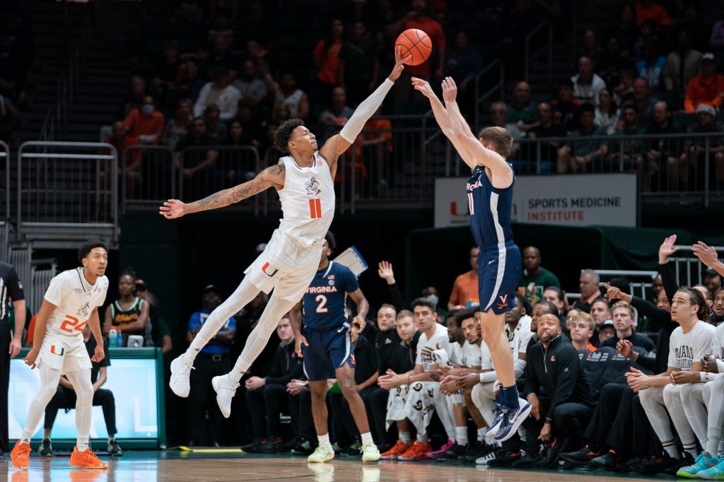 Fifth-year senior guard Jordan Miller blocks a jump shot during the first half of Miami’s game versus the University of Virginia in the Watsco Center on Dec. 20, 2022.