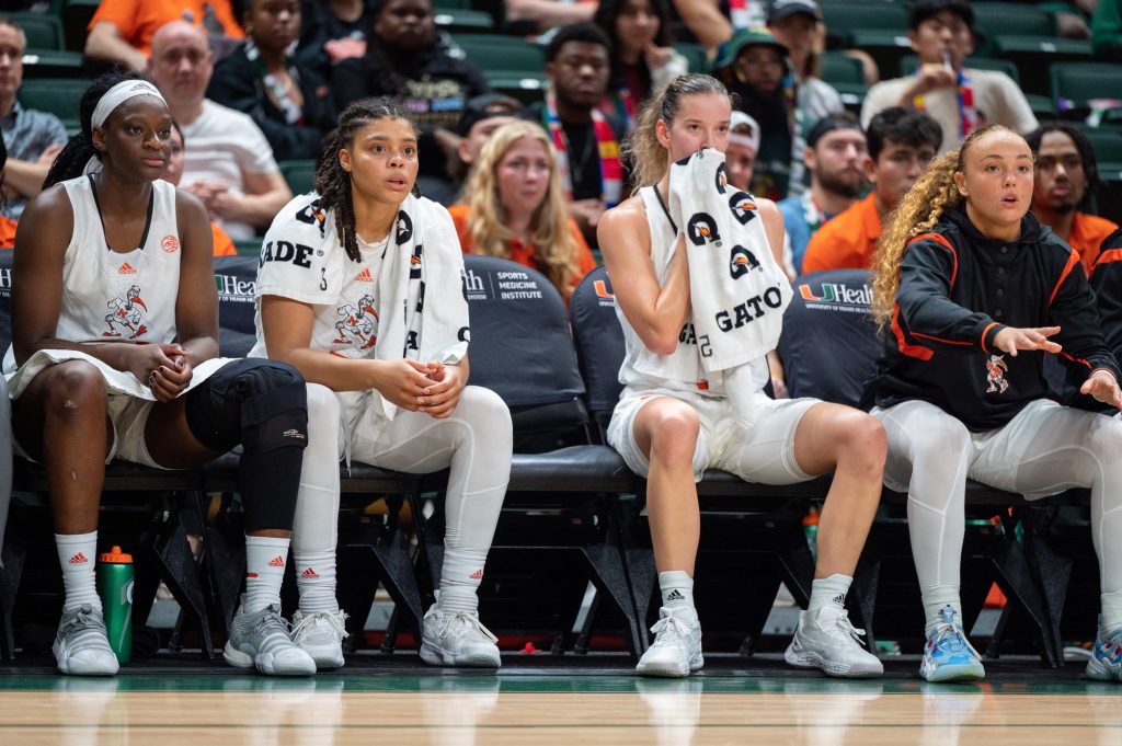 Miami players watch on with concern during their matchup against the University of Michigan on Thursday, Dec. 1 at the Watsco Center.