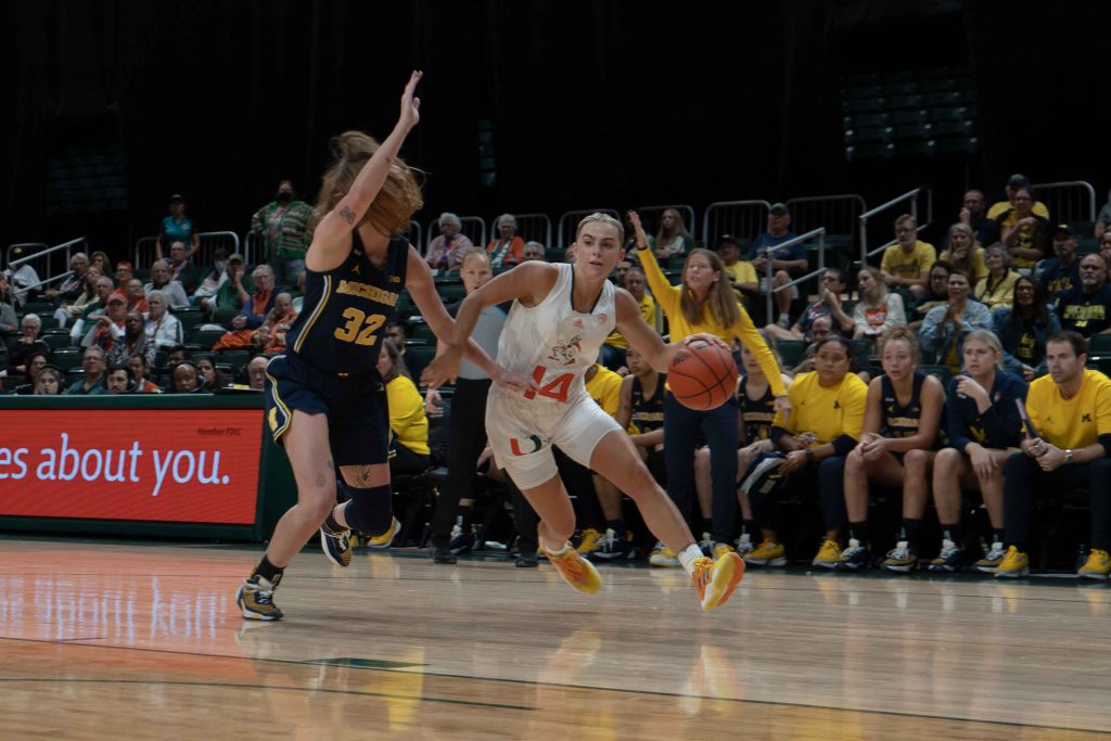 Senior guard Haley Cavinder drives to the basket during Miami’s game against the University of Michigan on Friday, Dec.1 at the Watsco Center.