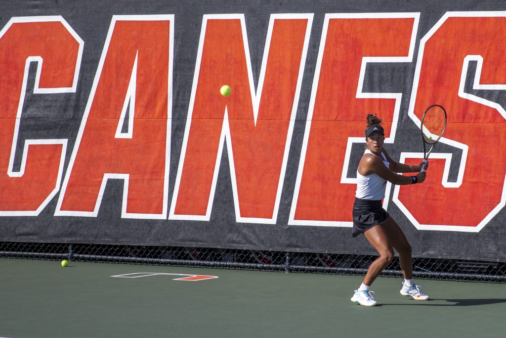 Fifth-year senior Daevenia Achong returns the ball to Florida Atlantic during Miami’s tournament against the Owls at the Neil Schiff Tennis Center on Tuesday, Jan. 24.