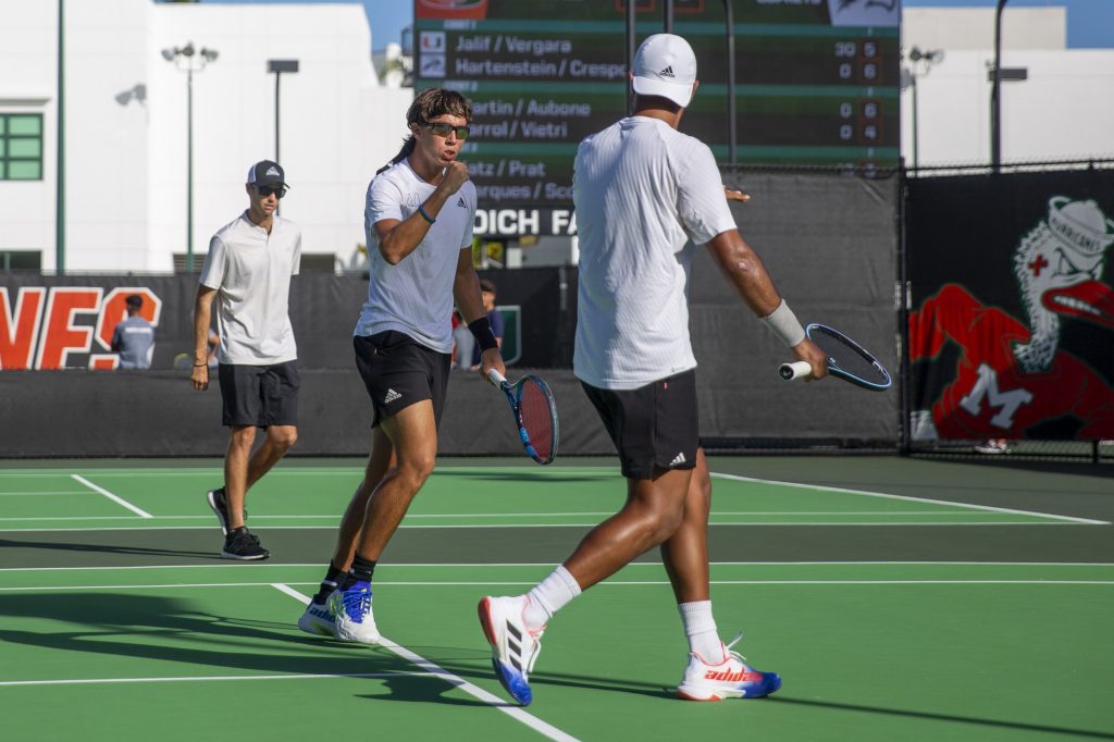 Freshman Martin Vergara Del Puerto and fifth-year senior Juan Martin Jalif celebrate a point during their doubles match against FNU on Friday, Feb. 10 at the Neil Schiff Tennis Center.