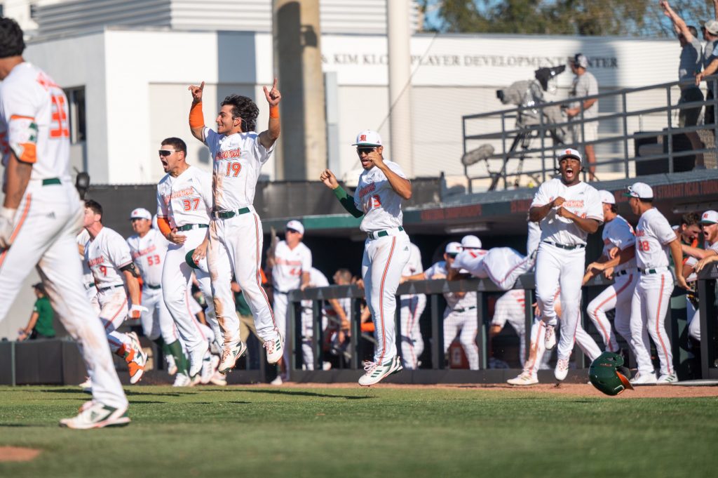 Miami players celebrate a walkoff homerun to secure a win over Penn State University on Sunday, Feb. 19 at Mark Light Field.