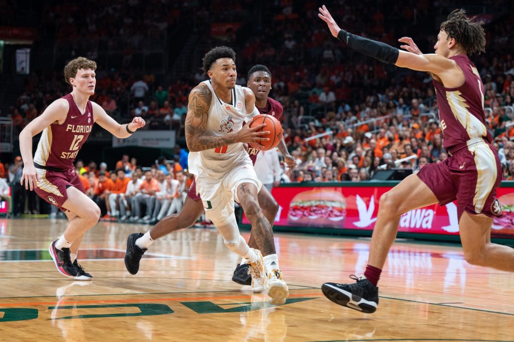 Fifth-year senior guard Jordan Miller drives to the basket during Miami's game against Florida State University on Saturday, Feb. 25 at the Watsco Center.