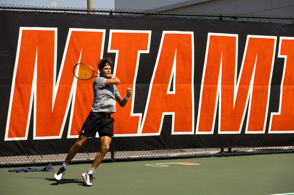 Graduate student Leonard Bierbaum returns the ball during Miami’s matches against South Alabama at the Neil Schiff Tennis Center on Wednesday, March 8.
