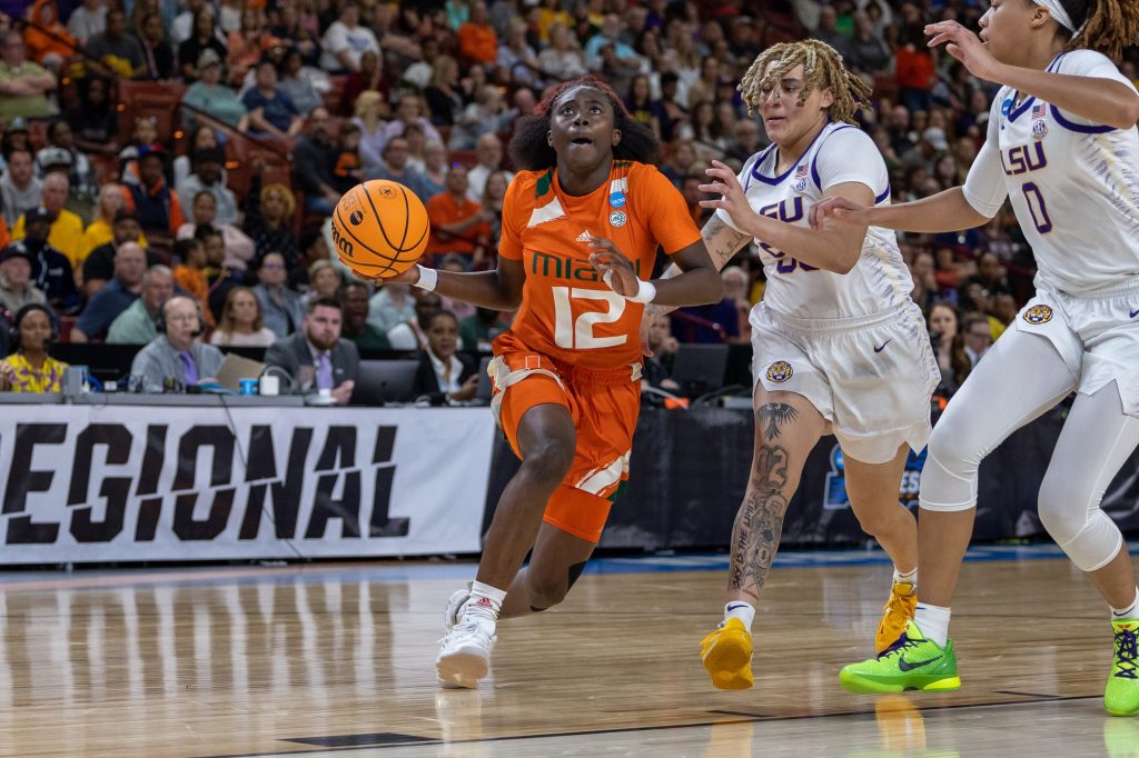 Sophomore guard Ja'Leah Williams drives the ball to the basket in the first quarter of Miami's matchup against LSU in the Elite Eight in the Bon Secours Wellness Arena on Sunday, March 26.