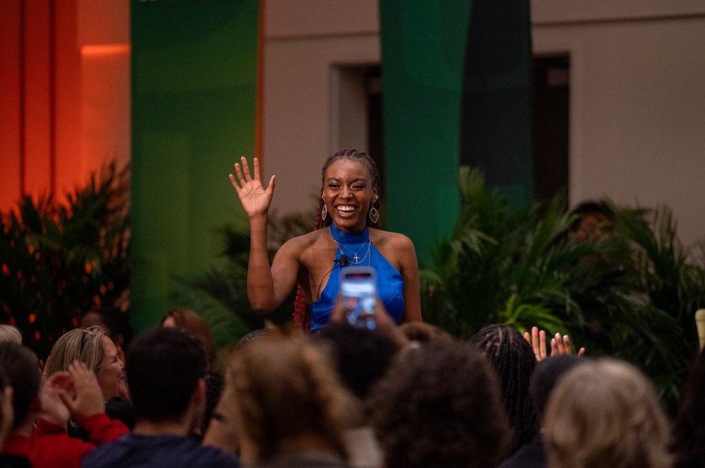 Student moderator Grace Altidor waves to the crowd prior to introducing guest Marlee Matlin at the What Matters to U event on March 3 in the Shalala Student Center.