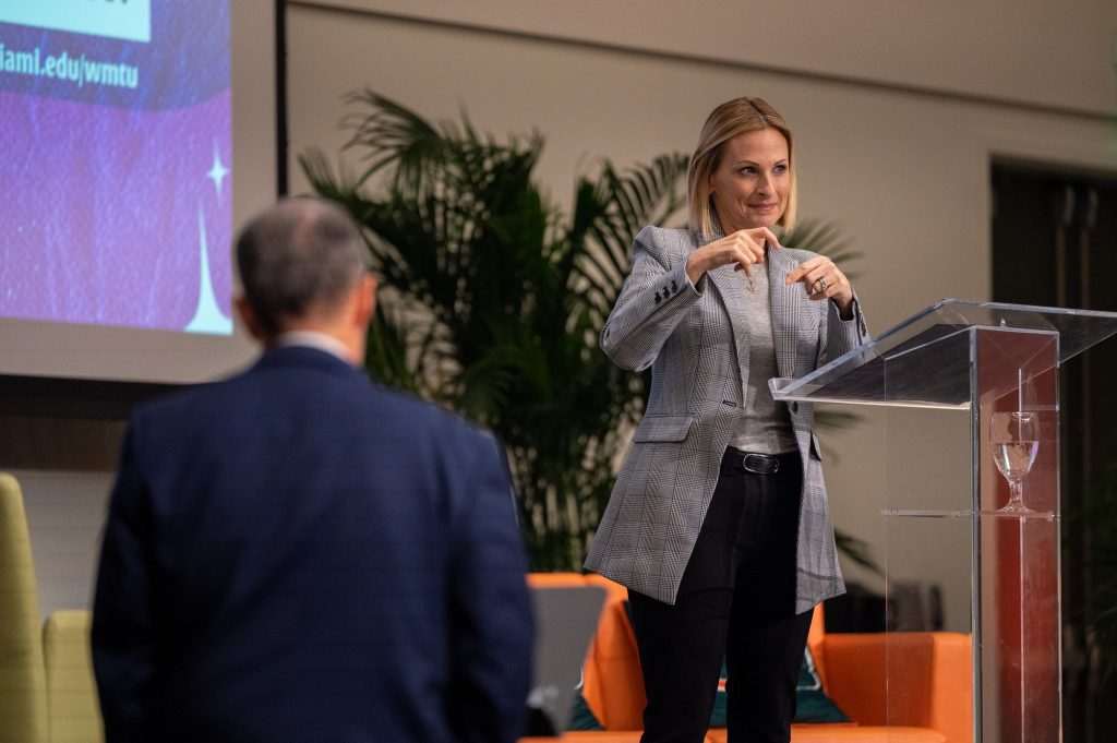 Marlee Matlin signs to the crowd during her What Matters to U presentation on March 2 in the Shalala Grand Ballrooms.