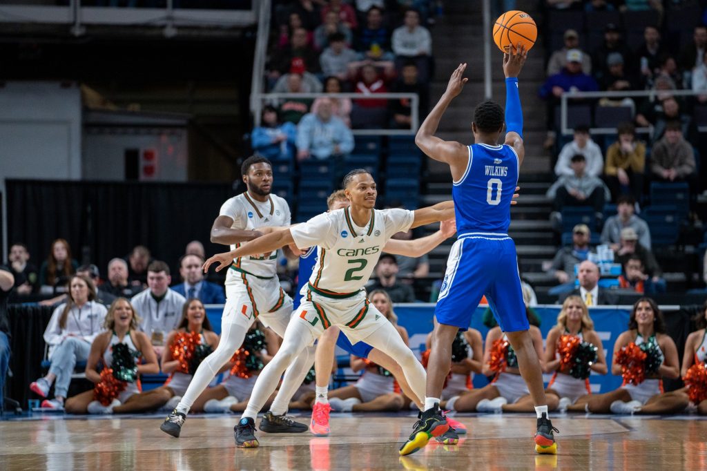 Fourth-year junior guard Isaiah Wong defends Bulldogs graduate student guard D.J. Wilkins during the first half of Miami’s Round of 64 matchup against Drake University in MVP Arena in Albany, N.Y. on March 17, 2023.