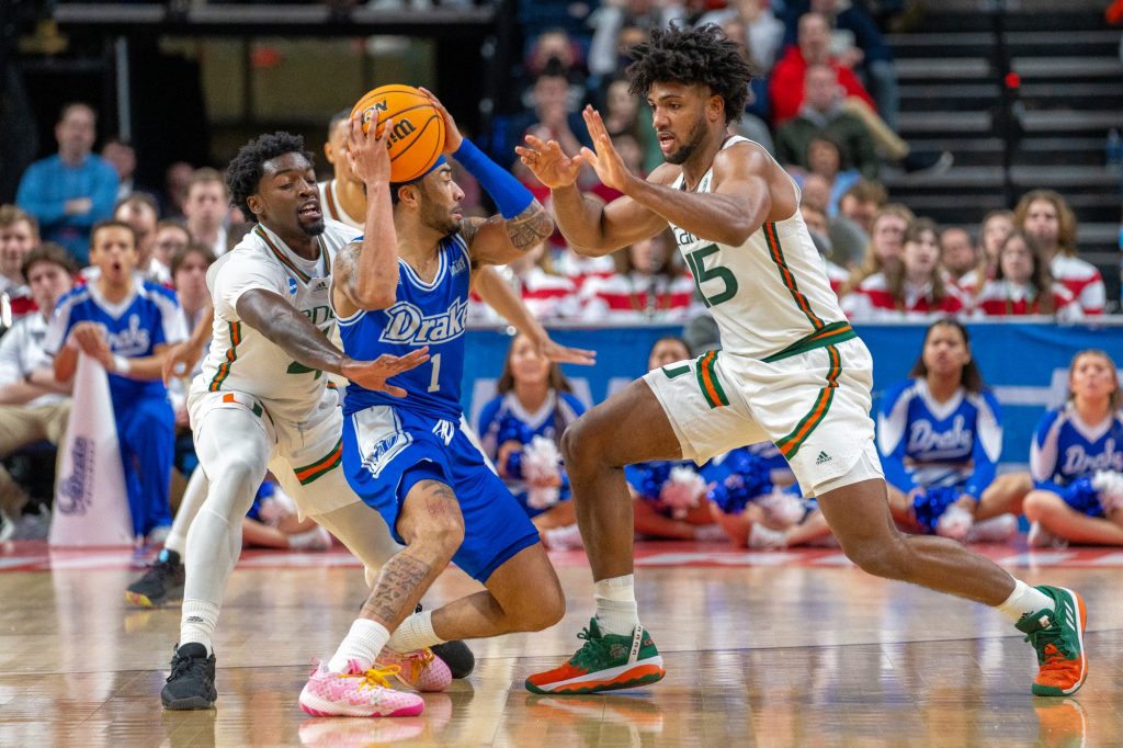 Sophomore guard Bensley Joseph and third-year sophomore forward Norchad Omier attempt to force a turnover during the second half of Miami’s Round of 64 matchup against Drake University in MVP Arena in Albany, N.Y. on March 17, 2023.
