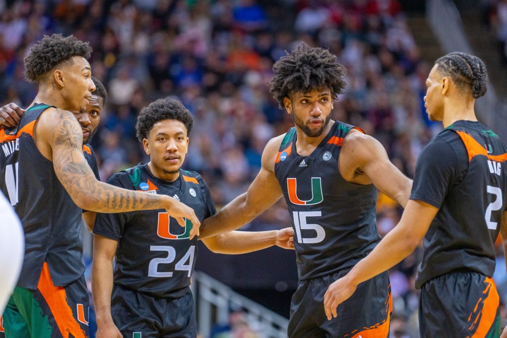 ‘Canes players huddle during the second half of Miami’s Sweet 16 matchup against Houston in the T-Mobile Center in Kansas City, MO on March 24, 2023.
