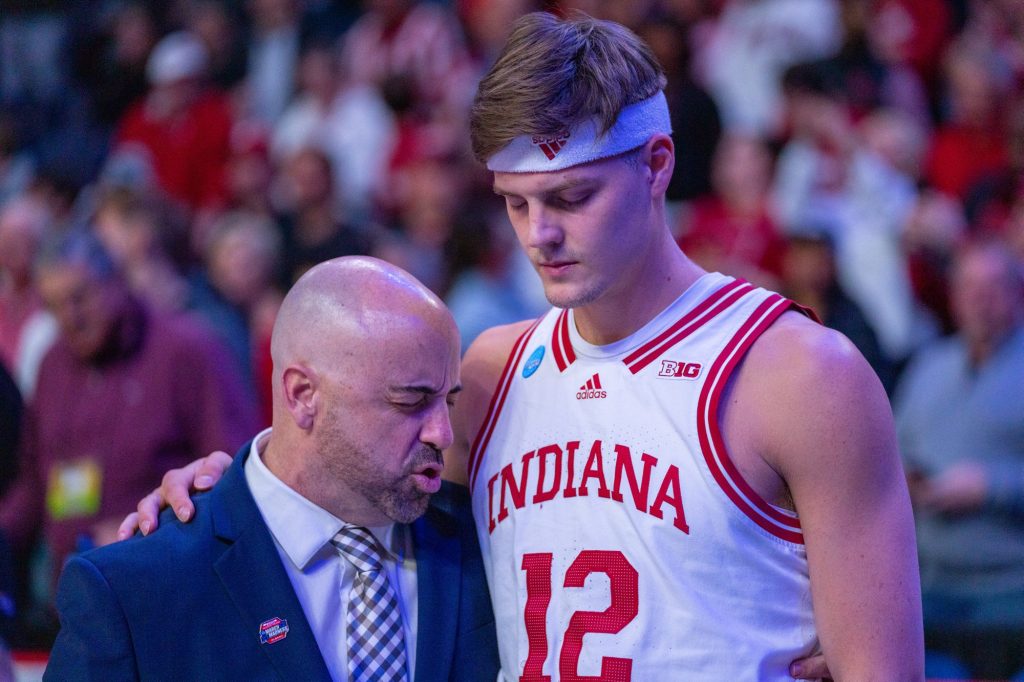 Fifth-year senior forward Miller Kopp prays before the start of Miami’s Round of 32 matchup against Indiana University in MVP Arena in Albany, N.Y. on March 19, 2023.