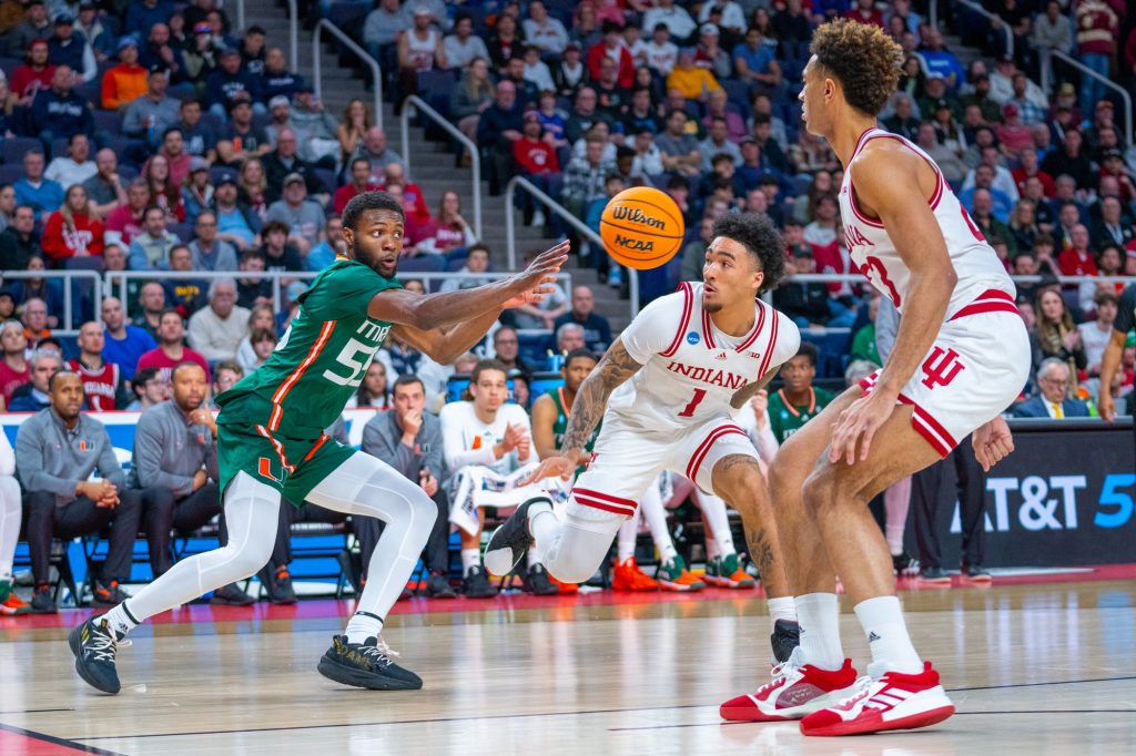 Sophomore guard Wooga Poplar passes the ball during the second half of Miami’s Round of 32 matchup against Indiana University in MVP Arena in Albany, N.Y. on March 19, 2023.