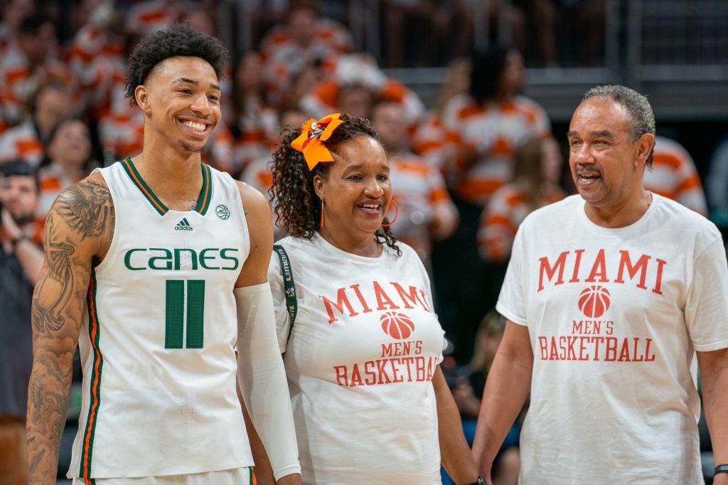 Fifth-year senior guard Jordan Miller and family smile during senior recognitions before Miami’s game versus Pittsburgh in the Watsco Center on March 4, 2023.