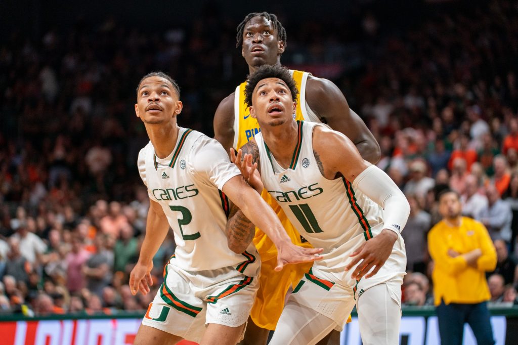 Guards Isaiah Wong and Jordan Miller look on during a free throw in the second half of Miami’s game versus the University of Pittsburgh in the Watsco Center on March 4, 2023.