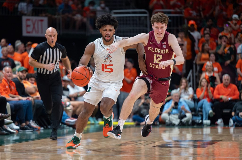 Third-year sophomore forward dribbles across the court during Miami's loss to Florida State University on Saturday, Feb. 25 at the Watsco Center.
