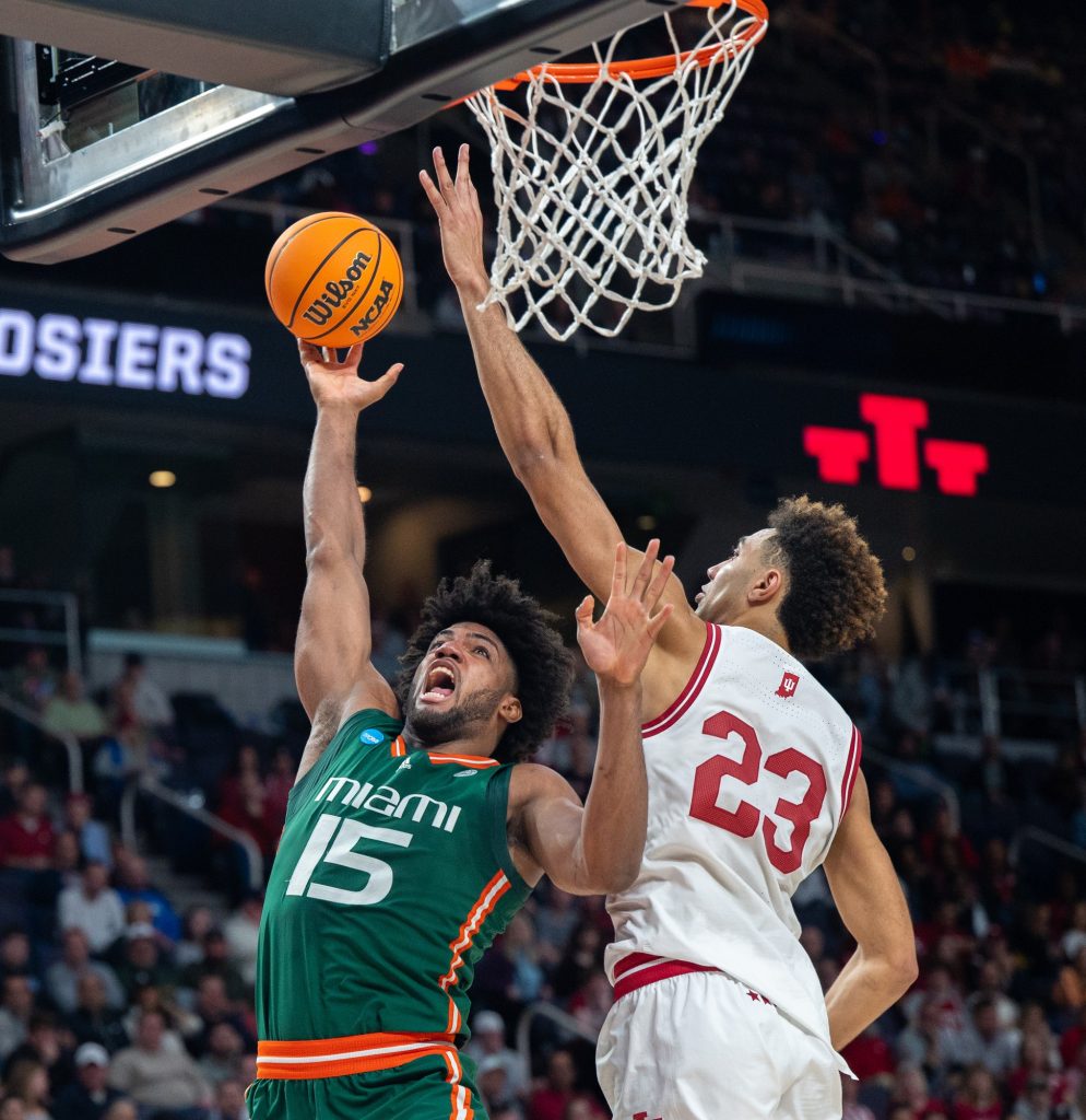 Third-year sophomore forward Norchad Omier throws the ball for a layup during the second half of Miami's Round of 32 game against Indiana University on Sunday, March 19 at the MVP Arena.