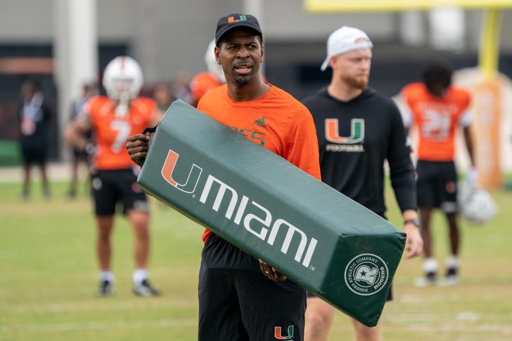 Wide receivers coach Kevin Beard holds a pad during a drill at Spring Practice at the Greentree Practice Fields on March 4, 2023.