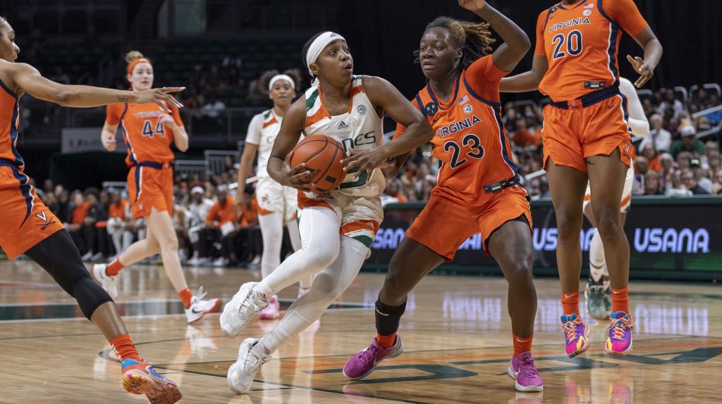 Sophomore guard Lashae Dwyer drives the ball towards the basket in the second quarter of Miami’s game against UVA at the Watsco Center on Sunday, Feb. 26.