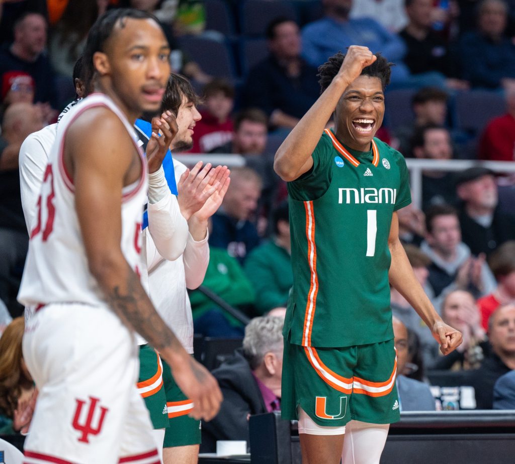 Fourth-year junior forward Anthony Walker celebrates his teammates during the second half of Miami's Round of 32 game against Indiana University on Sunday, March 19 at the MVP Arena.
