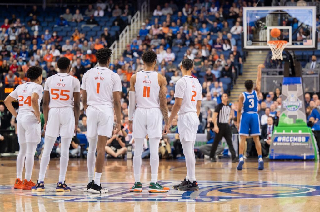 Miami players line up to watch Jeremy Roach of Duke University shoot a technical during the semifinal match of the ACC tournament on Friday, March 10 at the Greensboro Coliseum Complex.