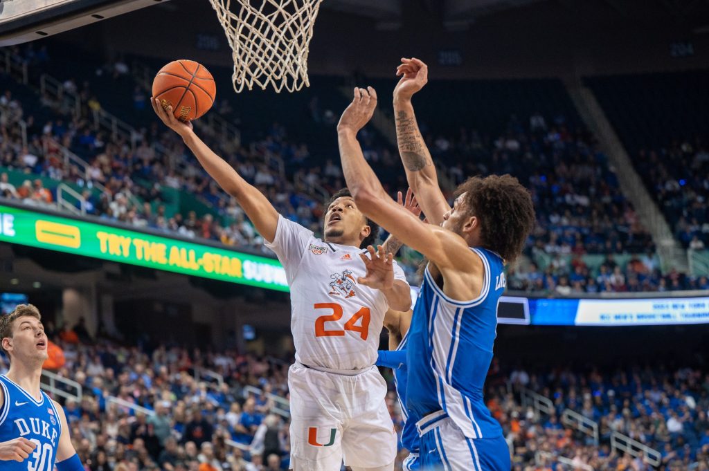 Third-year sophomore guard Nijel Pack completes a layup during Miami's game versus Duke University on Friday, March 10 at the Greensboro Coliseum Complex.